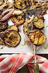Grilled aubergines with onions