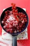 Sugared redcurrants in a pan