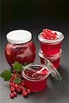 Raspberry jam and redcurrant jelly, redcurrants, leaves