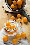 Mirabelles with sugar and preserving jar