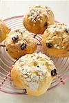 Several fruit scones with sugar on cake rack