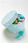 Coloured sugared almonds in blue box