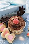 Christmassy chocolate muffin and heart-shaped biscuits