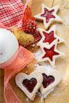 Heart- and star-shaped jam biscuits