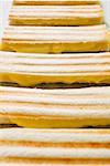 Several toasted cheese sandwiches in a row (detail)