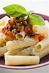 Rigatoni with tomato sauce, olives and Parmesan (close-up)