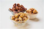 Assorted nuts to nibble in bowls