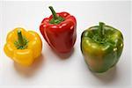 Three peppers (yellow, red, green)