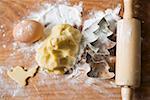 Biscuit dough, biscuit cutters, flour, egg and rolling pin