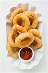 Deep-fried onion rings with ketchup