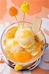 Fruity ice cream sundae with apricots (overhead view)