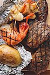 Surf and Turf (beef steaks and prawns) with baked potato
