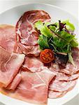 Sausage platter with raw ham and salami from Italy