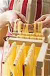 Hanging home-made ribbon pasta up to dry