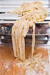 Home-made ribbon pasta on pasta maker