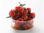 Roasted cherry tomatoes in plastic container