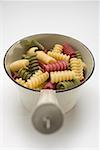 Coloured riccioli in strainer