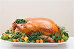 Stuffed roast turkey with kumquats and herbs