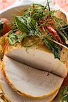 Roast turkey with chillies and herbs, partly carved