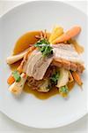 Roast belly pork with crackling and root vegetables