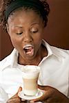 Woman drinking latte macchiato