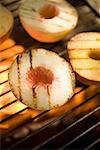 Peaches on a barbecue grill rack