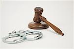 A gavel and handcuffs