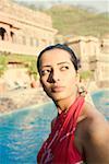 Side profile of a young woman at the poolside