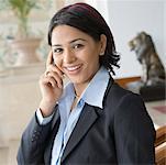 Portrait of a businesswoman talking on a mobile phone and smiling