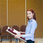 Portrait of a businesswoman standing at a lectern
