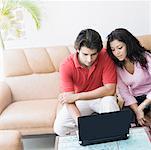 Young couple using a laptop