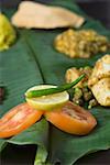 Close-up of Indian food on a banana leaf