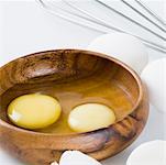 Close-up of egg yolks in a wooden bowl