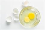 Close-up of egg yolks in a glass bowl