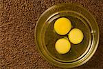 Close-up of egg yolks in a glass bowl