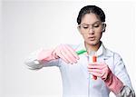 Close-up of a female lab technician holding test tubes