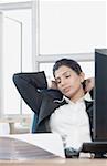 Close-up of a businesswoman sleeping in an office