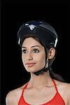 Close-up of a young woman wearing a cycling helmet