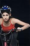 Close-up of a female cyclist riding a bicycle