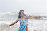 Young couple standing on the beach