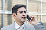 Close-up of a businessman talking on a mobile phone