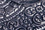 Close-up of a carved metal sheet