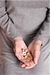 Elderly Woman Holding Pills