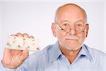 Man Holding Pill Dispenser