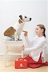 Girl Playing Veterinarian with Dog