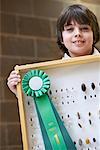 Student With First Place Ribbon on His Science Project