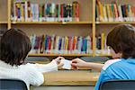 Students Passing Notes in Library