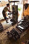 Woman Making Clay Roof Tiles, Central Java, Java, Indonesia