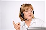 Businesswoman with Headset and Laptop Computer