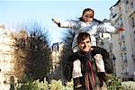 Daughter Riding on Father's Shoulders, Paris, France